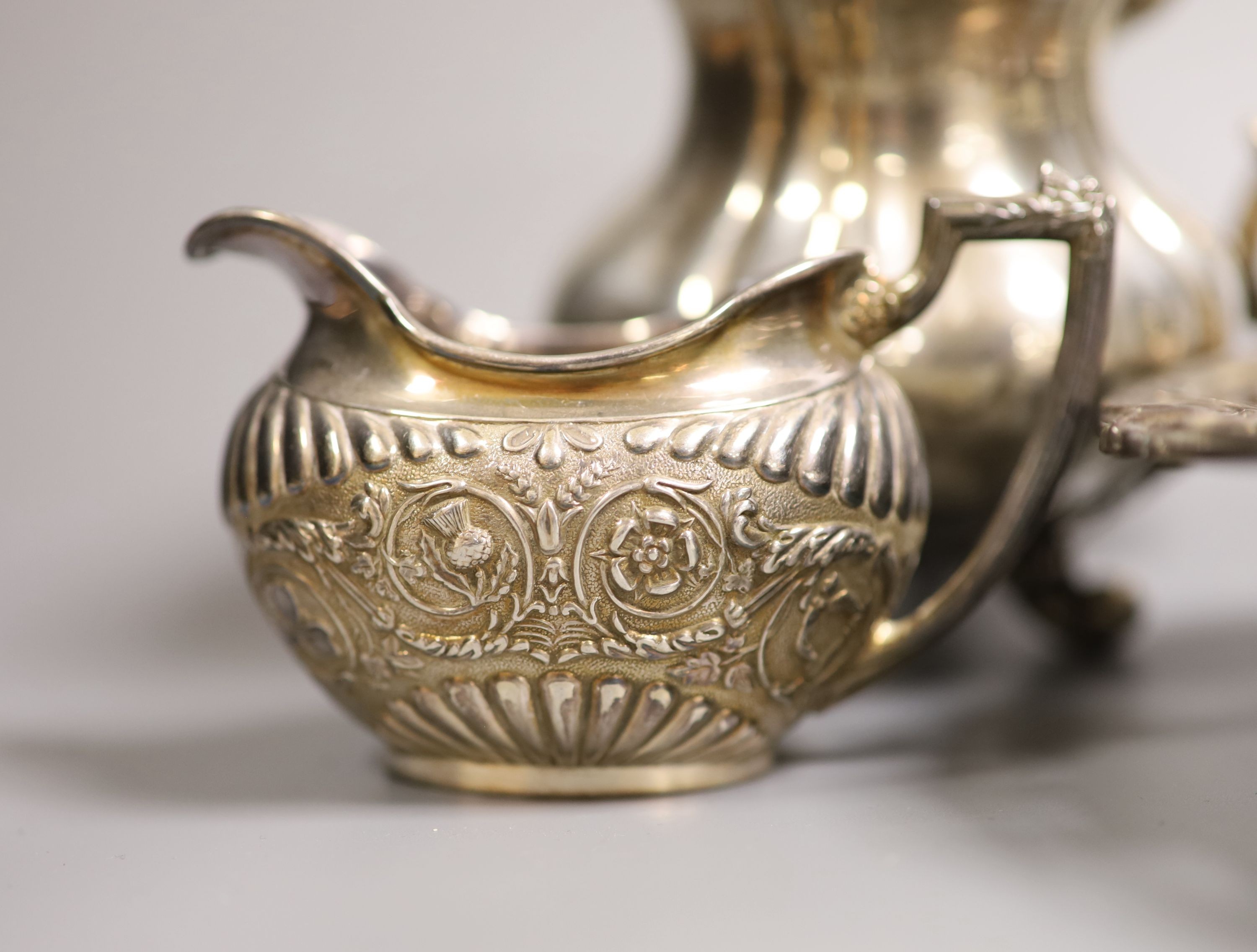 A silver dish, marks rubbed, a silver cream jug, similar 800 jug and five other items, weighable silver 28oz.